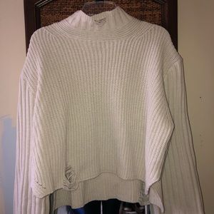 White distressed turtleneck sweater